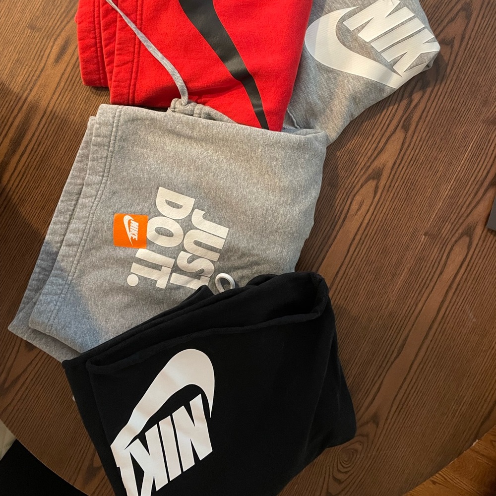 Four pairs of Nike sweatpant shorts
